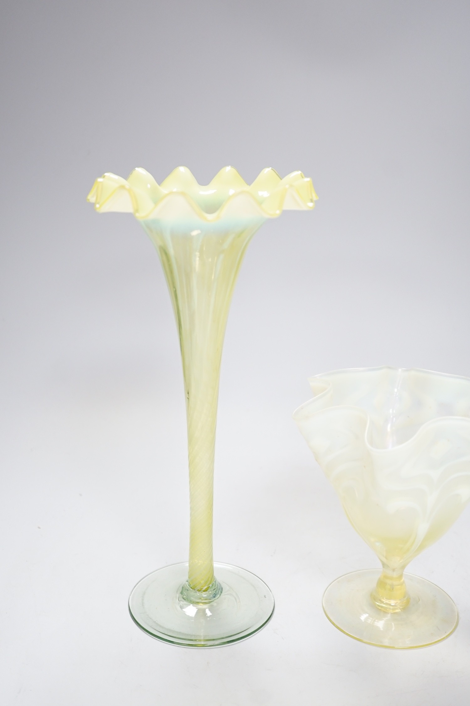 Two early 20th century vaseline glass vases, tallest 29cm
